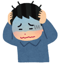 頭を抱える男性